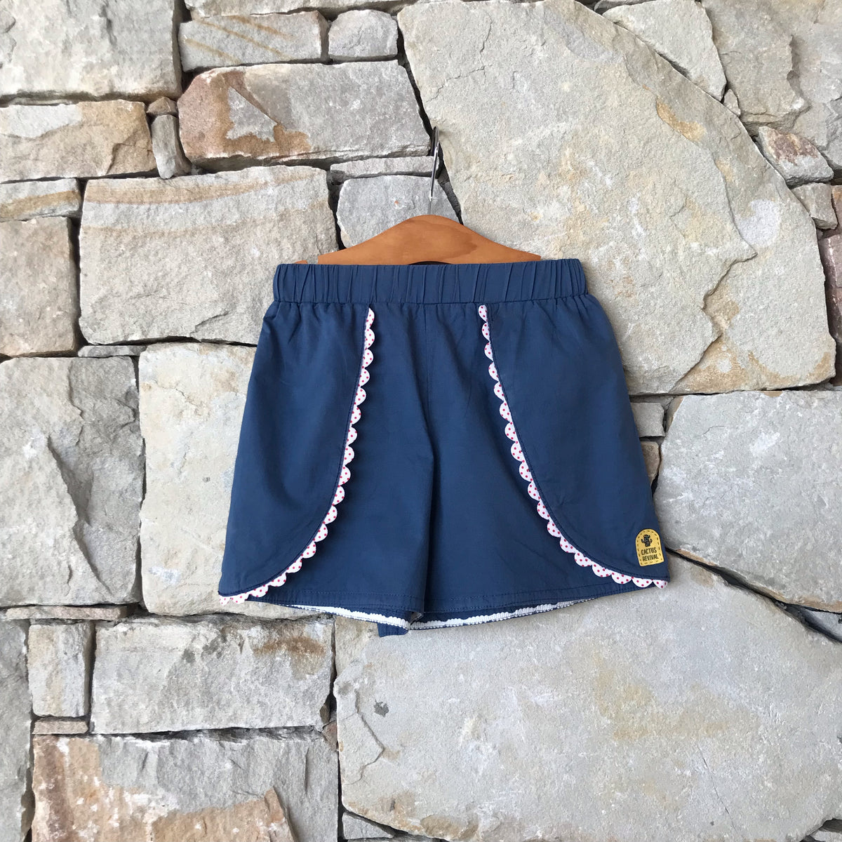 Navy shorts with red dot trim: Size 6